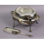 A silver-plated breakfast dish of oval form with fluted decoration to the domed lid, on four foliate