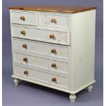 A natural & white-finish pine chest fitted two short & four long drawers with turned knob handles, &