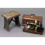 A Singer hand sewing machine with case; together with a needlework table (with contents); various