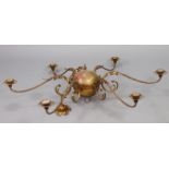 An Edwardian-style gilt-metal six-branch chandelier with a spherical centre, & with scroll-arms, 48”