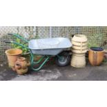 An aluminium wheelbarrow; together with a chimney pot; & various garden flower pots.