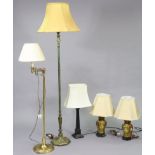 Two brass standard lamps; & two table lamps each with shade.