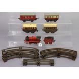 A vintage Hornby tinplate clockwork-operated “00” gauge train set, unboxed.