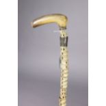A 19th century shark’s vertebrae gent’s walking cane with a polished horn handle, 38” long (w.a.f.).