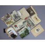 Approximately one hundred various loose postcards & family photographs.