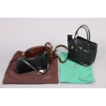 Two Mulberry black simulated crocodile-skin handbags; & a similar snake-skin handbag.