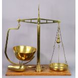 A set of vintage brass counter-top beam scales by Bartlett & Sons of Bristol (to weigh 2lbs) with