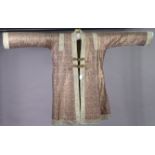 A Chinese silk embroidered housecoat of mauve & gold ground, and with all-over repeating design.