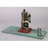 A VINTAGE MARKLIN GERMAN VERTICAL STEAM ENGINE MODEL, 12¾” HIGH, mounted on a painted wooden