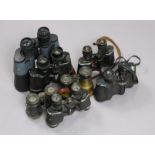 Seven pairs of binoculars (each lacking case).