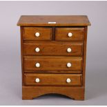 A walnut apprentice-piece chest fitted two short & three long drawers with ceramic knob handles, 12”