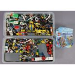 A large quantity of assorted Lego, loose; & numerous Lego construction booklets.