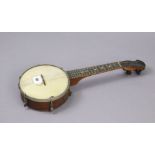 A vented “Broadcaster” banjolele, 21” long.