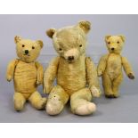 A vintage Merrythought Hygienic Toys teddy bear, 21½” tall; together with two other vintage teddy