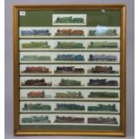 A display of twenty-five coloured illustrations of railway locomotives in a glazed frame, 28¾” x