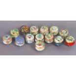 Fourteen Halcyon Days enamel Christmas boxes, ranging from 1975 to 1981, & 1983 to 1989.