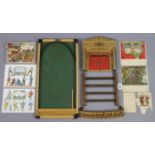 A vintage “Pollocks” puppet theatre with numerous accessories; & a Kay of London bagatelle board,