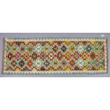 A Chobi Kilim runner of ivory & crimson ground, with repeating multi-coloured geometric design to