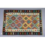 A Chobi Kilim rug of crimson & ivory ground, with repeating multi-coloured geometric design to