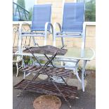 A wrought-metal rectangular three-tier potting table, 43” wide x 36½” high; a silvered-metal