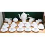 A Coalport bone china white glazed “Countryware” thirty-one piece extensive part coffee service.