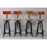 A set of four black-finish metal & wooden bar stools.