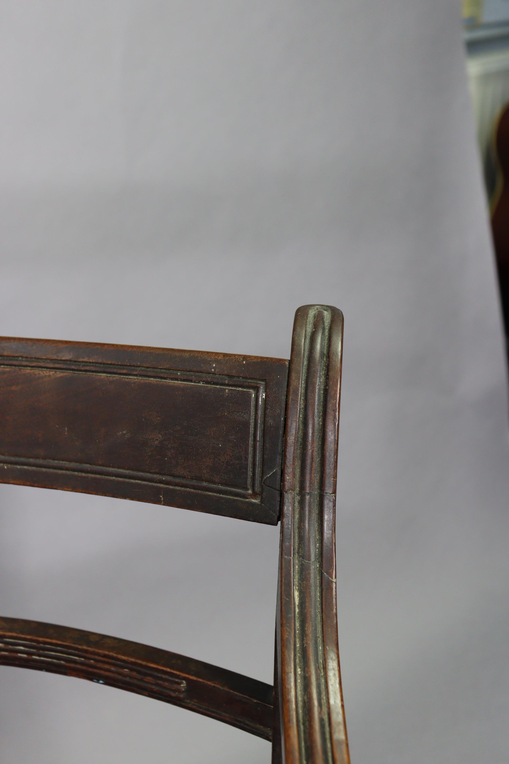 A 19th century mahogany bow-back carver chair with a padded seat, & on fluted sabre legs; together - Image 4 of 6