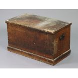 An early 20th century pine blanket box with a hinged lift-lid, & with wrought-iron side handles,