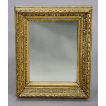 A gilt frame rectangular wall mirror with a raised scroll border, 24” x 19½”, & a copper engraved