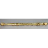A gold painted wooden curtain pole with acorn & foliate finials, 74” long.