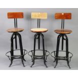 A set of three black-finish metal & wooden bar stools.