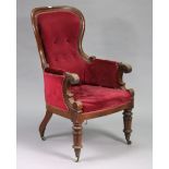 A Victorian buttoned spoon-back armchair with a padded seat and back upholstered crimson velour, &