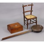 A 19th century child’s rail-back chair with a woven-cane seat, & on turned legs with spindle