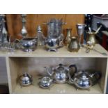 A silver plated three-piece tea service; a pair of silver plated candlesticks; & various other items