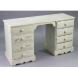 A white painted pine kneehole dressing table fitted four long drawers to each pedestal, & a shaped