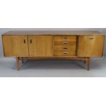 A mid-20th century G-Plan 'E.Gomme' teak sideboard fitted with an arrangement of four long drawers &