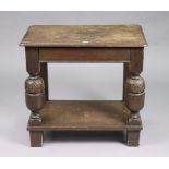 A carved oak rectangular two-tier occasional table on bulbous-turned supports, 29” wide x 27” high x