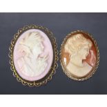 A carved shell oval cameo brooch depicting a classical female bust, in yellow metal open-work