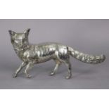 An early 20th century continental silver model of a fox on all-fours, the removable head turned to