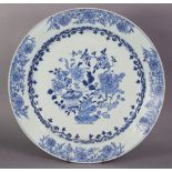 An 18th century Chinese blue & white porcelain large dish, decorated with prunus, peony,