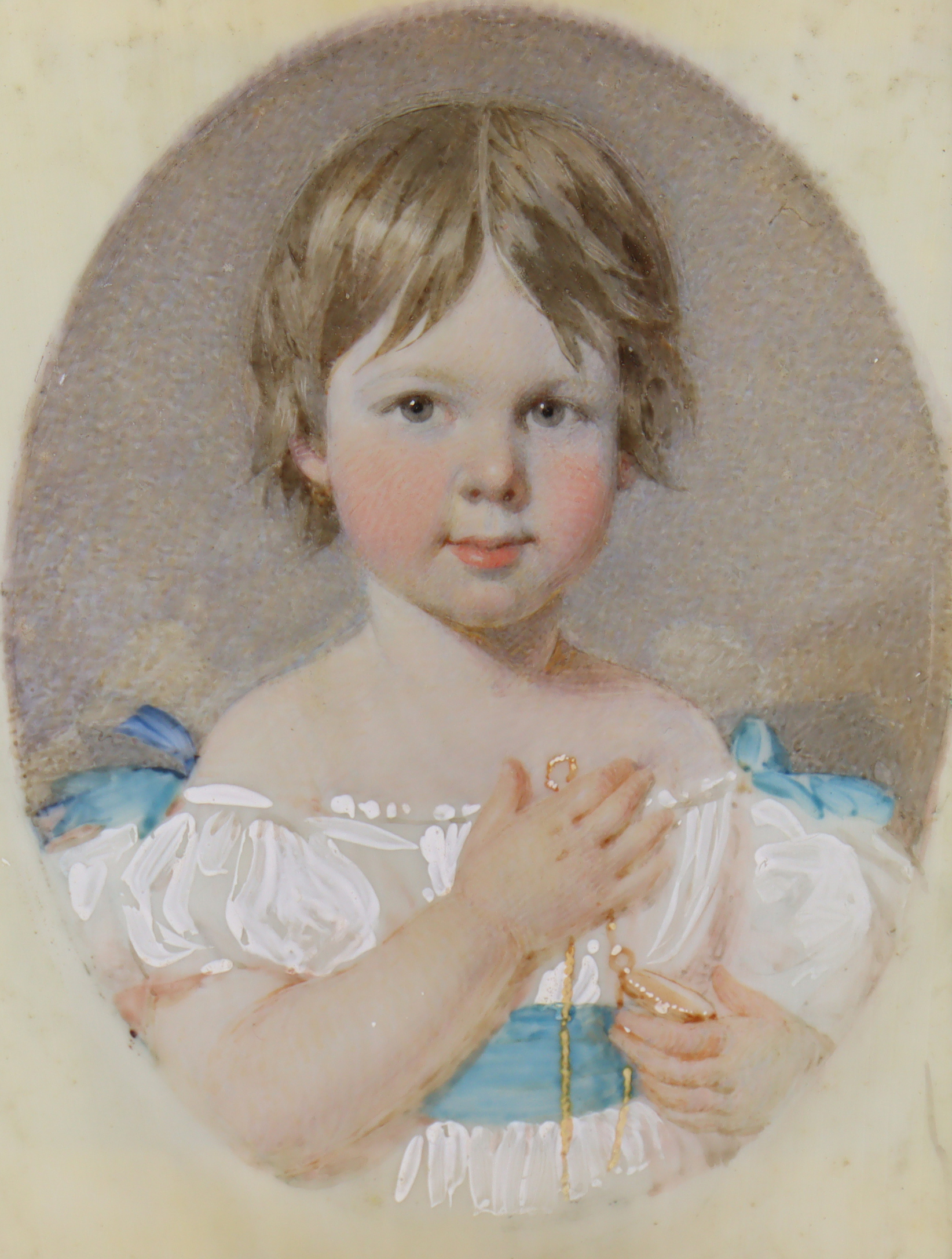 ENGLISH SCHOOL late 19th/early 20th century. A portrait miniature of a young girl wearing white