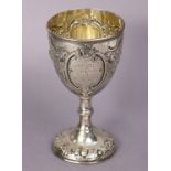 A Victorian silver Agricultural Show trophy cup with embossed floral decoration, & engraved
