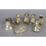 A George V silver pepper pot, Birmingham 1931 by H. Matthews, four similar silver pepper pots; a