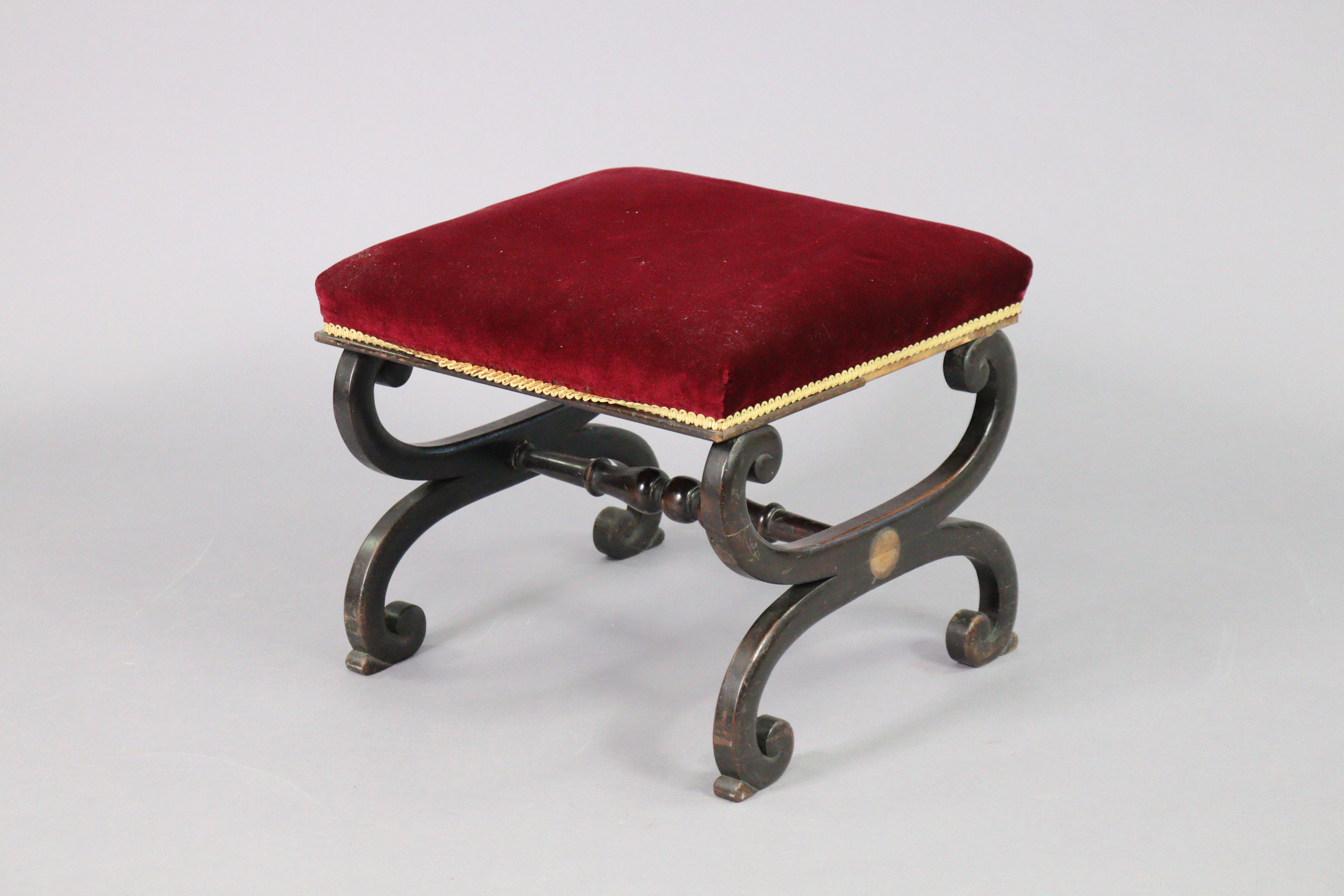 A Victorian mahogany footstool, the padded seat upholstered crimson velour, on curved x-shaped - Image 2 of 4