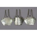 Three Victorian engraved silver wine labels, inscribed: "Sherry", "Port", & "Scotch Whiskey";