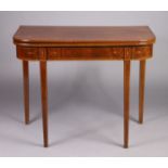 A Regency mahogany tea table with rounded corners to the rectangular fold-over top & with inlaid