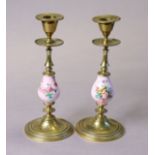 A pair of continental pink-ground porcelain & brass candlesticks on round bases, 8.25" high.