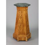 A late 19th/early 20th century continental pedestal of tapered hexagonal form veneered in satin-