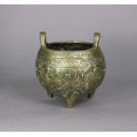 A Chinese gilt-bronze censer, of globular form, decorated with figure scenes in reserves on a