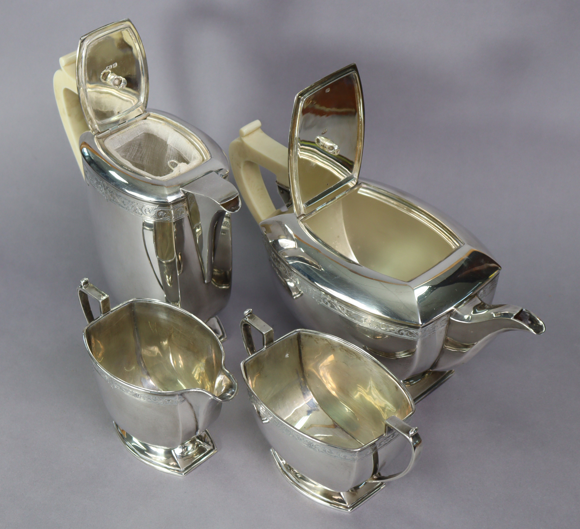 An Art Deco silver four-piece tea & coffee service of curved oblong form, each with narrow band of - Image 2 of 3